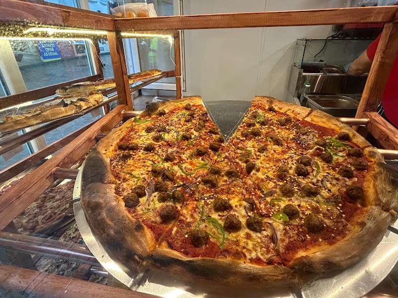 Pollini’s Pizza Slice - Lands lane